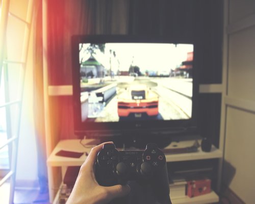 Person playing games in an exhibition context